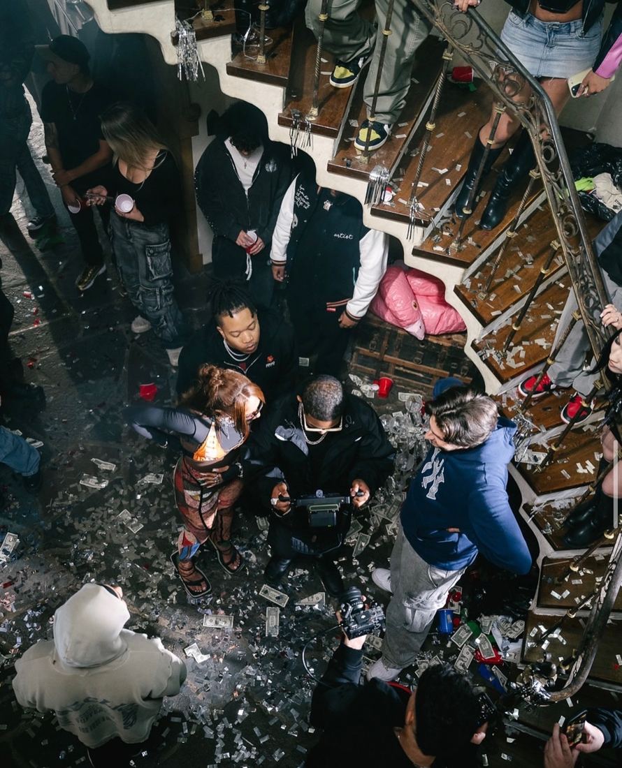 Overhead view of a party scene being shot on a staircase